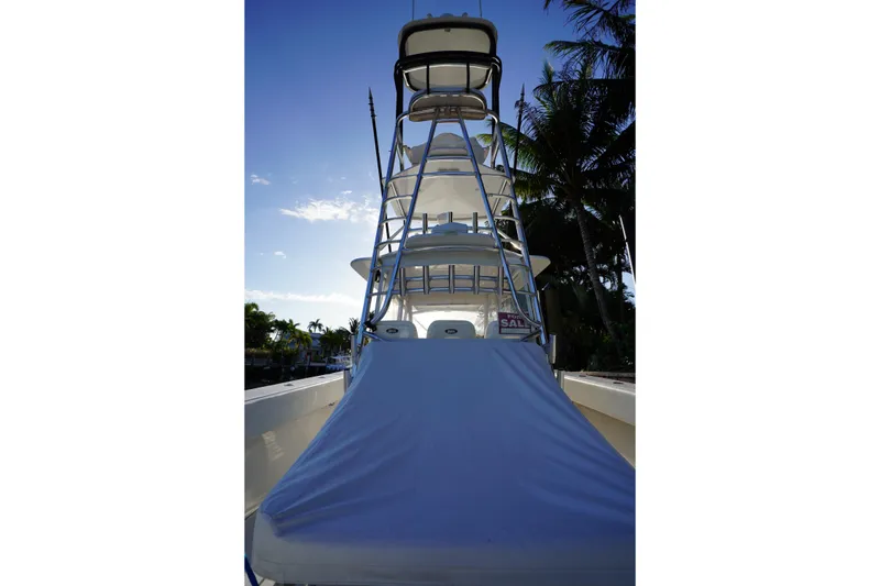 Slide: The Image of 2014 SeaHunter 45 Tournament boat with tower, docked under a clear sky. - 13