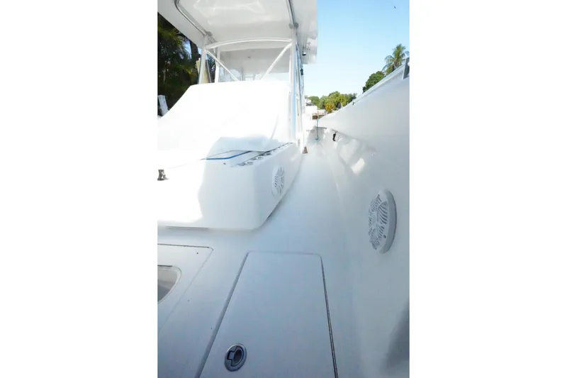Slide: The Image of 2014 SeaHunter 45 Tournament boat deck, showcasing sleek white design and spacious layout. - 26