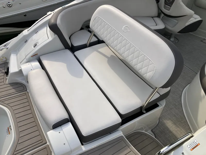 Slide: The Image of Crownline 270 XSS 2023 boat with luxurious cushioned seating area. - 13