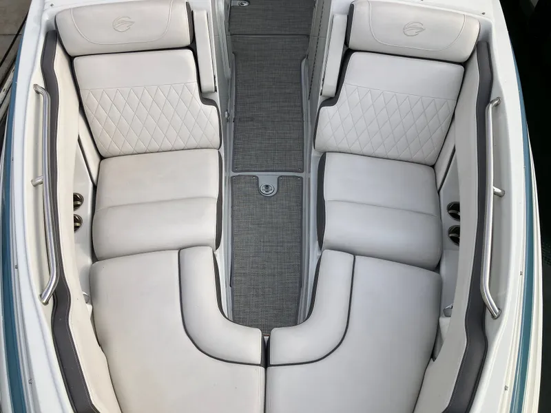 Slide: The Image of Interior of 2023 Crownline 270 XSS with luxurious white seating. - 24