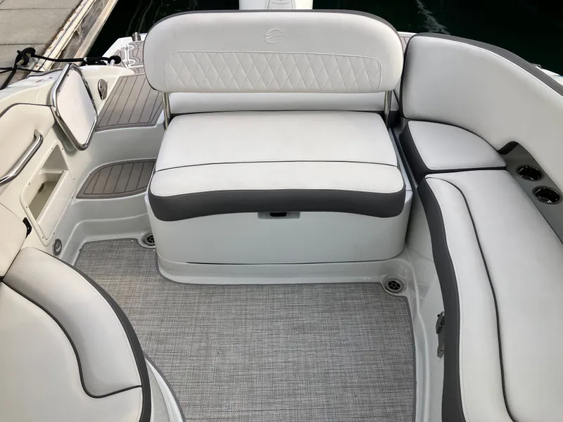 Slide: The Image of Interior of 2023 Crownline 270 XSS with sleek white seating. - 26