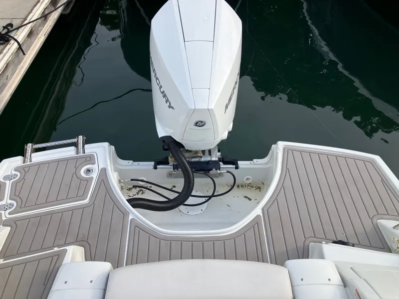 Slide: The Image of Crownline 270 XSS 2023 with Mercury outboard motor at dock. - 27
