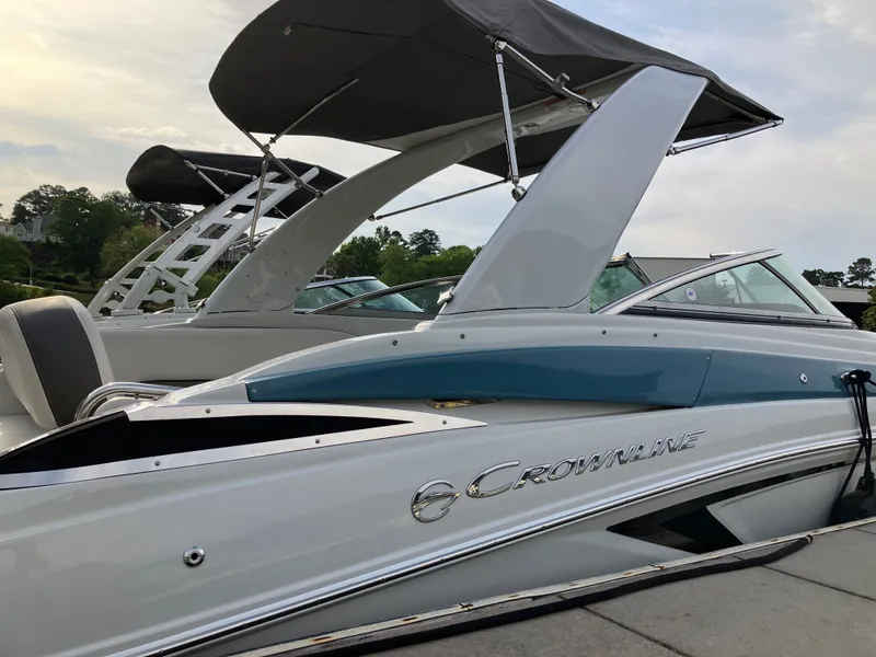 Slide: The Image of 2023 Crownline 270 XSS boat with sleek design and sunshade. - 28