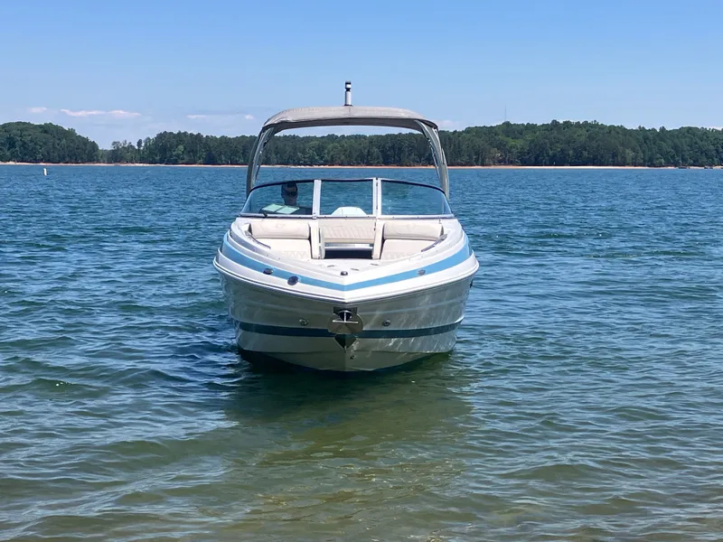 Slide: The Image of 2023 Crownline 270 XSS boat on calm water. - 3