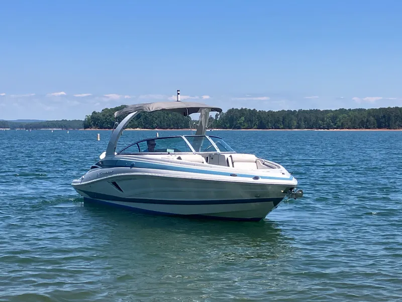 Slide: The Image of 2023 Crownline 270 XSS boat on calm water. - 4