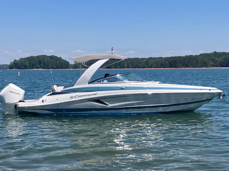 Slide: The Image of 2023 Crownline 270 XSS boat on calm water. - 6