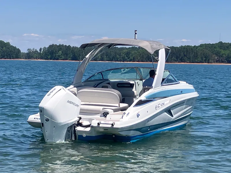 Slide: The Image of 2023 Crownline 270 XSS boat on calm water. - 7