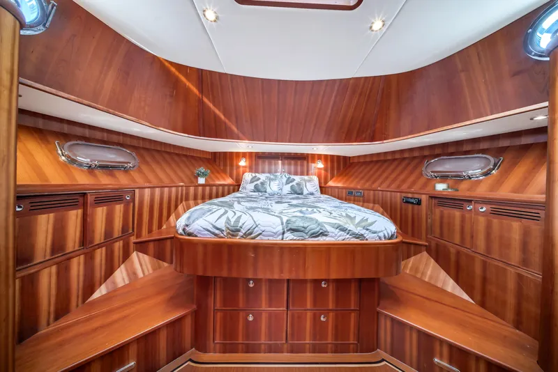Slide: The Image of Luxurious wooden cabin interior of 2011 Hunt 52 yacht with cozy bed and elegant design. - 18