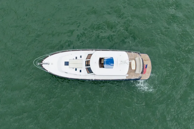 Slide: The Image of Aerial view of 2011 Hunt 52 yacht cruising on green ocean waters. - 5