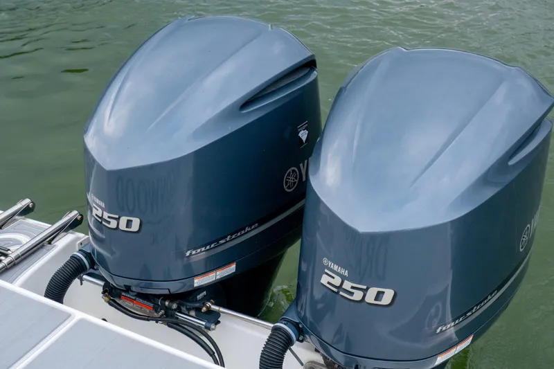 Slide: The Image of Twin Yamaha 250 outboard motors on a 2014 Sea Hunt Gamefish 27 boat. - 12