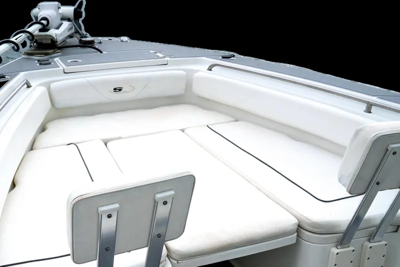 Slide: The Image of 2014 Sea Hunt Gamefish 27 boat interior with white cushioned seating. - 7