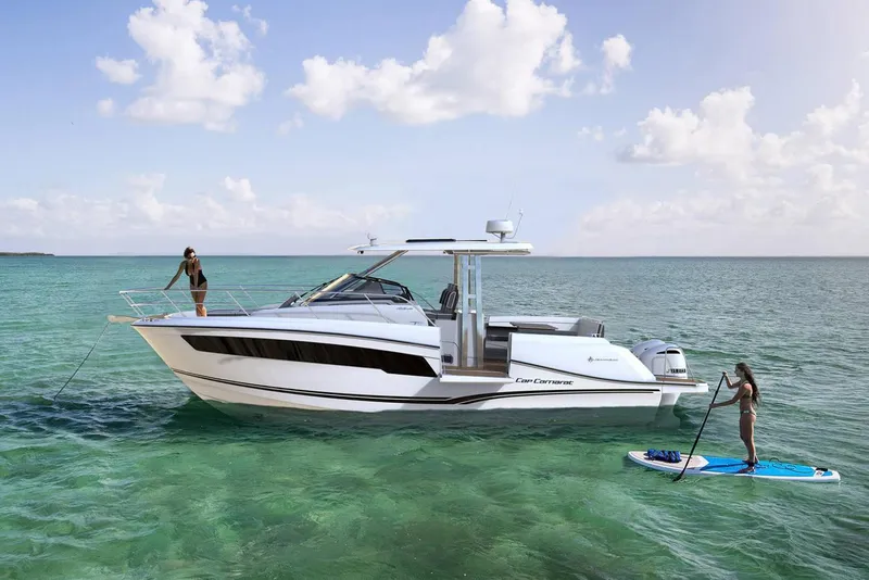 Slide: The Image of Manufacturer Provided Image: 2022 Jeanneau Leader 10.5 WA Series 2 boat on clear water with paddleboarders. - 3