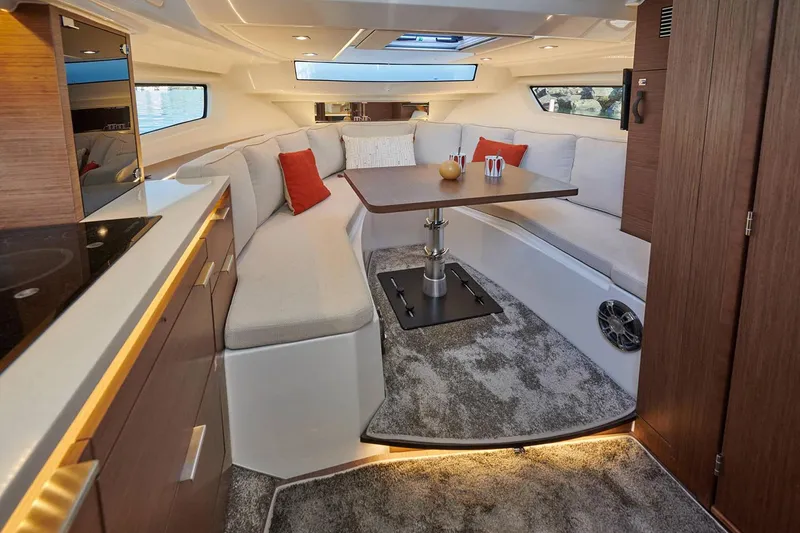 Slide: The Image of Manufacturer Provided Image: Luxurious interior of 2022 Jeanneau Leader 10.5 WA Series 2 with modern seating and dining area. - 7
