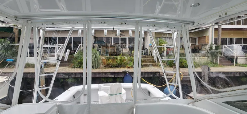 Slide: The Image of 1995 Cabo 35 Express boat interior with marina view. - 44