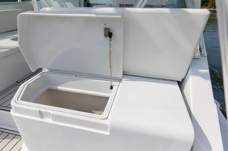 Slide: The Image of Open storage compartment on 1995 Cabo 35 Express boat, showcasing interior space. - 59
