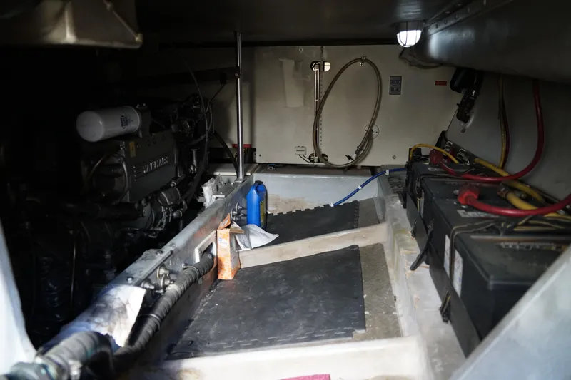 Slide: The Image of Engine room of a Mainship boat with visible machinery and batteries. - 33