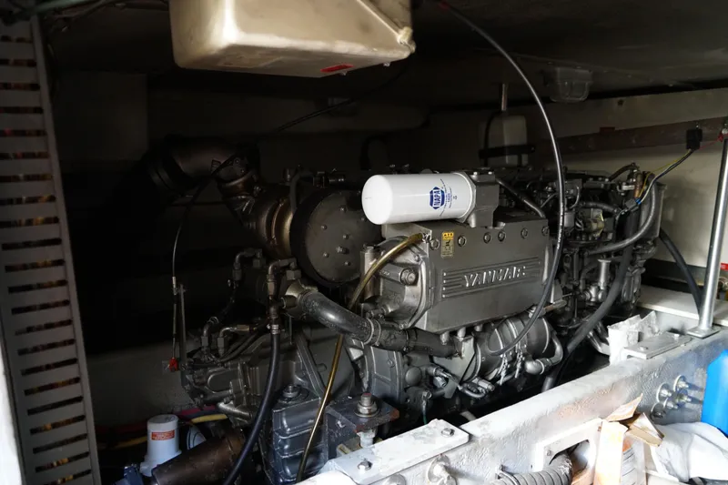 Slide: The Image of Engine compartment of a Mainship boat featuring a Yanmar diesel engine. - 34