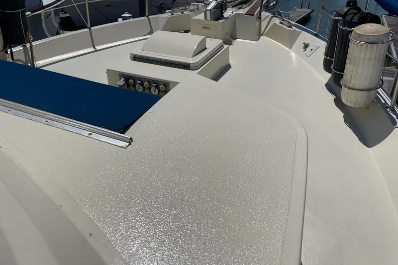 Slide: The Image of 1976 Hatteras 48 Long Range Cruiser deck with equipment and railing. - 10