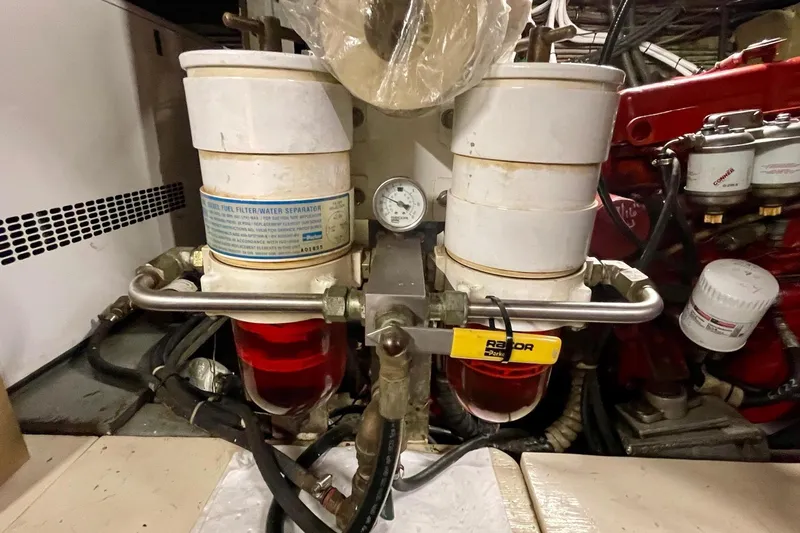 Slide: The Image of Engine room of 1976 Hatteras 48 Long Range Cruiser with fuel filter system. - 22