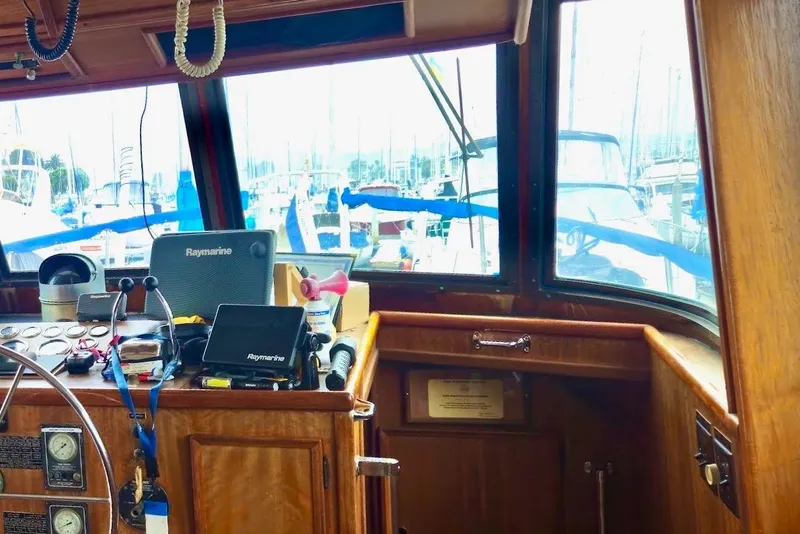 Slide: The Image of Interior view of 1976 Hatteras 48 Long Range Cruiser helm with navigation equipment. - 25