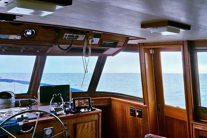 Slide: The Image of Pilothouse of 1976 Hatteras 48 Long Range Cruiser with ocean view. - 30