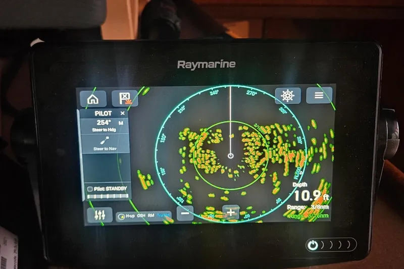 Slide: The Image of Raymarine navigation display on 1976 Hatteras 48 Long Range Cruiser showing radar and depth. - 36