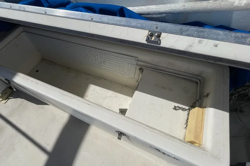 Slide: The Image of Open storage compartment on a 1976 Hatteras 48 Long Range Cruiser boat. - 38