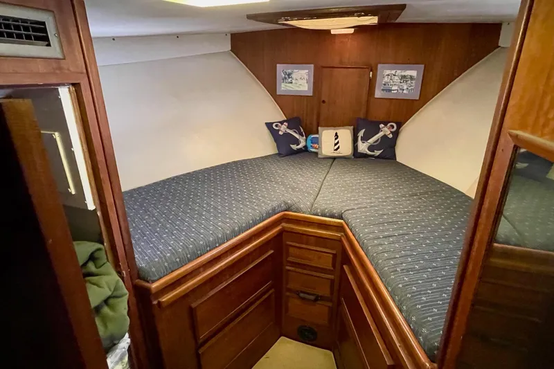 Slide: The Image of Cozy cabin interior of 1976 Hatteras 48 Long Range Cruiser with nautical decor. - 53