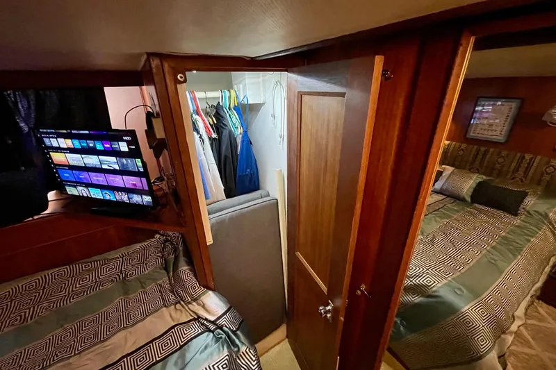 Slide: The Image of Interior of 1976 Hatteras 48 Long Range Cruiser with cozy bedroom and TV. - 62
