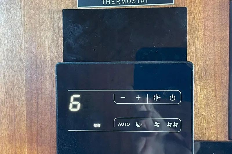 Slide: The Image of Digital thermostat on 1976 Hatteras 48 Long Range Cruiser, displaying settings and controls. - 70
