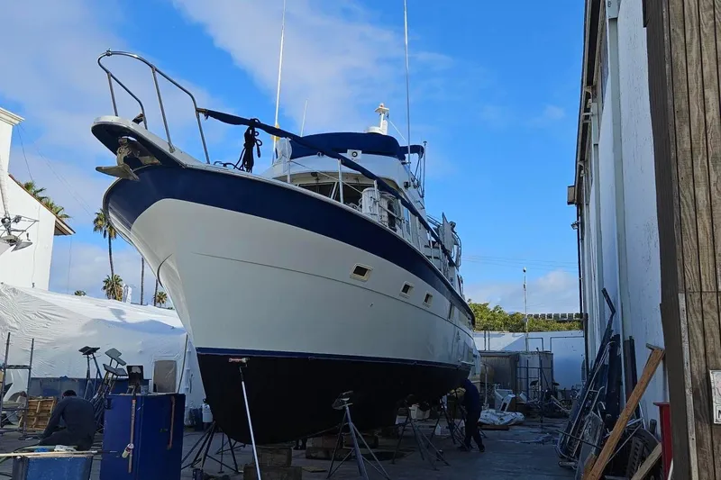 Slide: The Image of 1976 Hatteras 48 Long Range Cruiser in dry dock, undergoing maintenance. - 78