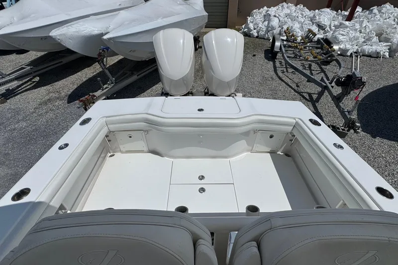 Slide: The Image of 2013 Jupiter 32 Cuddy boat with dual engines, viewed from the cockpit area. - 10