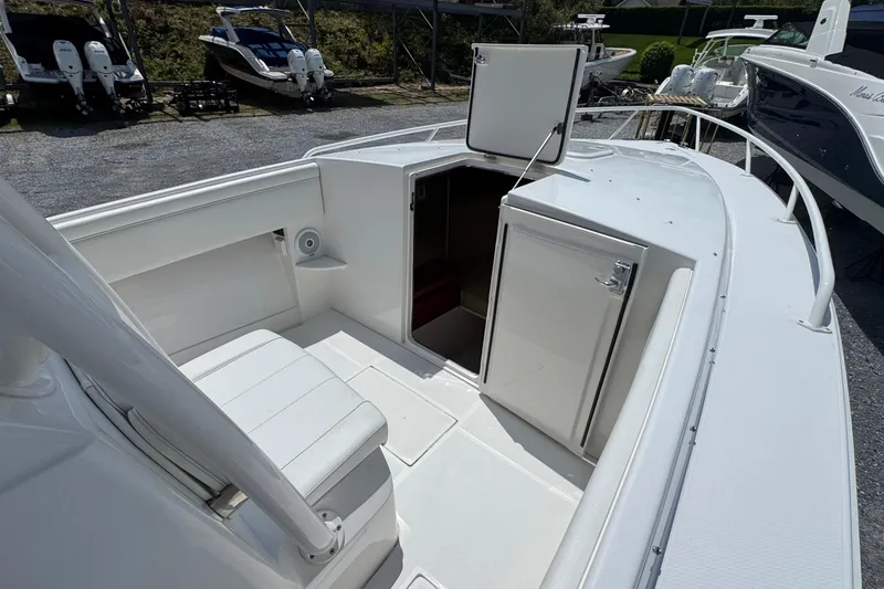 Slide: The Image of 2013 Jupiter 32 Cuddy boat interior with open cabin door and seating area. - 34