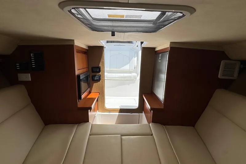 Slide: The Image of Interior of 2013 Jupiter 32 Cuddy boat with seating and storage. - 36