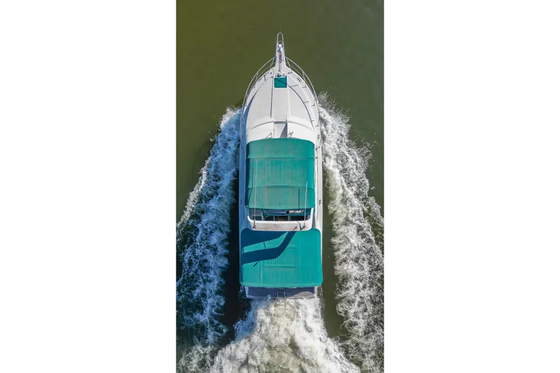 Slide: The Image of Aerial view of 1994 Carver 380 Santego yacht cruising on water. - 13