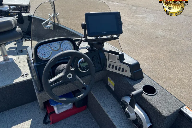 Slide: The Image of 2023 Lund 1650 Rebel XL SS boat dashboard with steering wheel and navigation system. - 6
