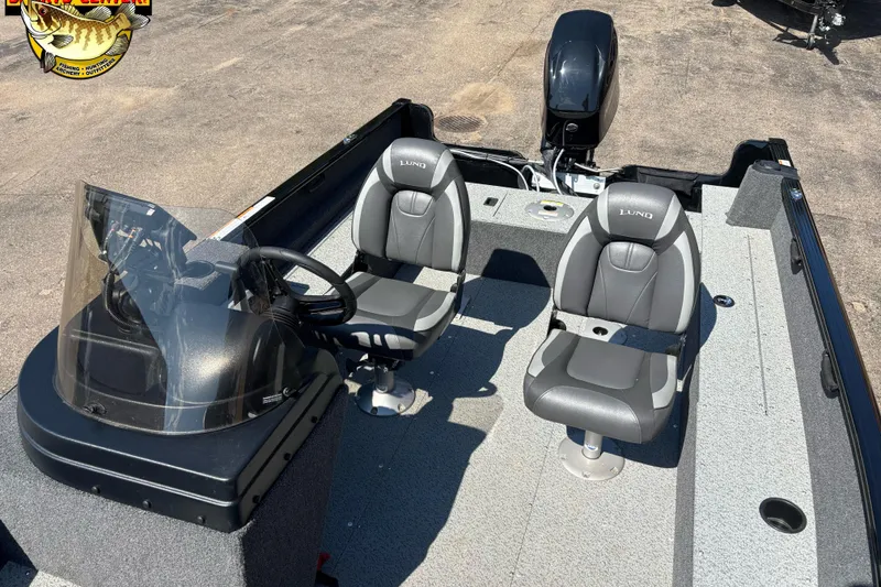 Slide: The Image of 2023 Lund 1650 Rebel XL SS boat interior with two seats and steering console. - 9