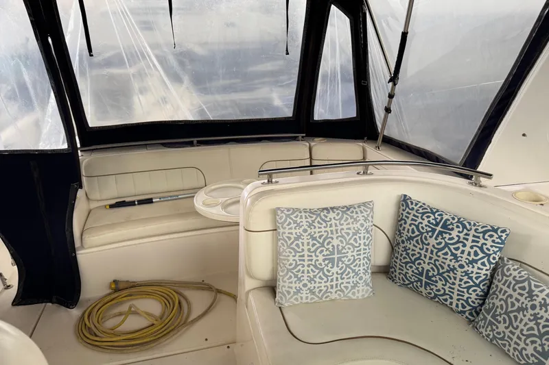 Slide: The Image of Interior of 2002 Rinker Fiesta Vee 310 boat with patterned cushions and coiled rope. - 12