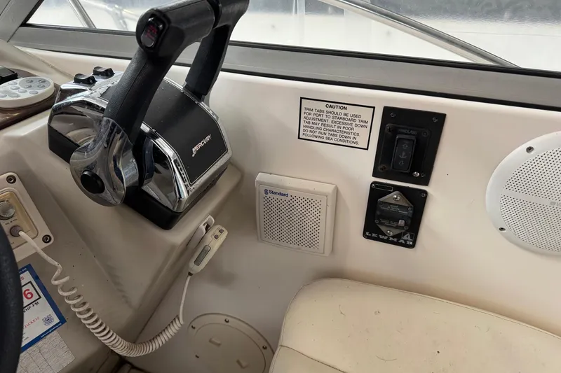 Slide: The Image of Control panel of a 2002 Rinker Fiesta Vee 310 boat with Mercury throttle. - 3