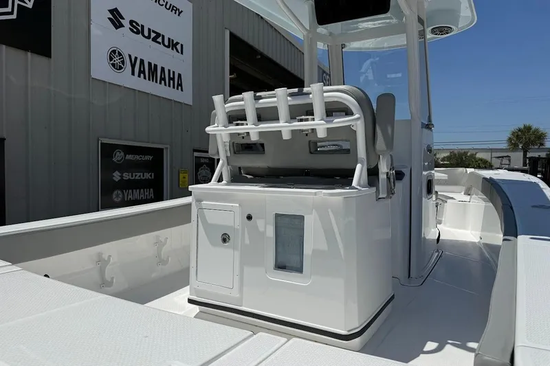 Slide: The Image of 2026 Blazer Bay Makaira 2600 boat interior with seating and storage, displayed at dealership. - 11
