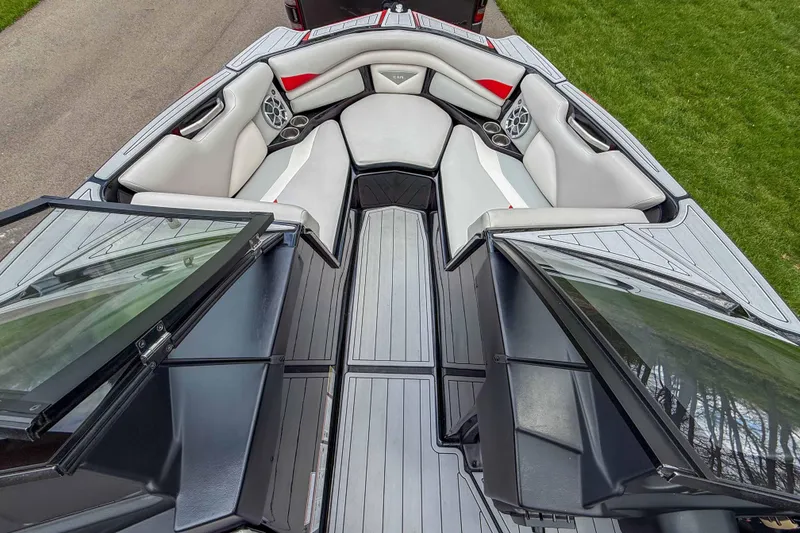 Slide: The Image of 2016 Axis A22 boat interior with sleek seating and modern design elements. - 14