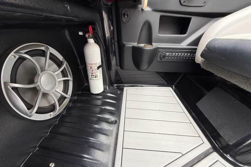 Slide: The Image of 2016 Axis A22 interior with speaker, fire extinguisher, and control panel. - 22