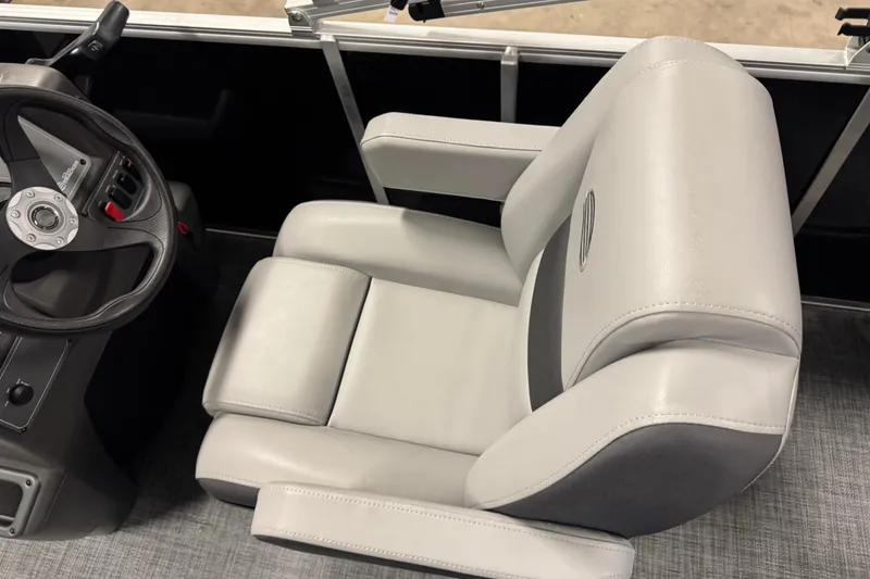 Slide: The Image of Captain's chair and steering wheel of 2026 Sun Tracker Party Barge 16 DLX. - 10