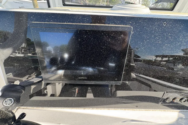 Slide: The Image of Dashboard of 2026 Tidewater 220 CC Adventure boat with Garmin display. - 11