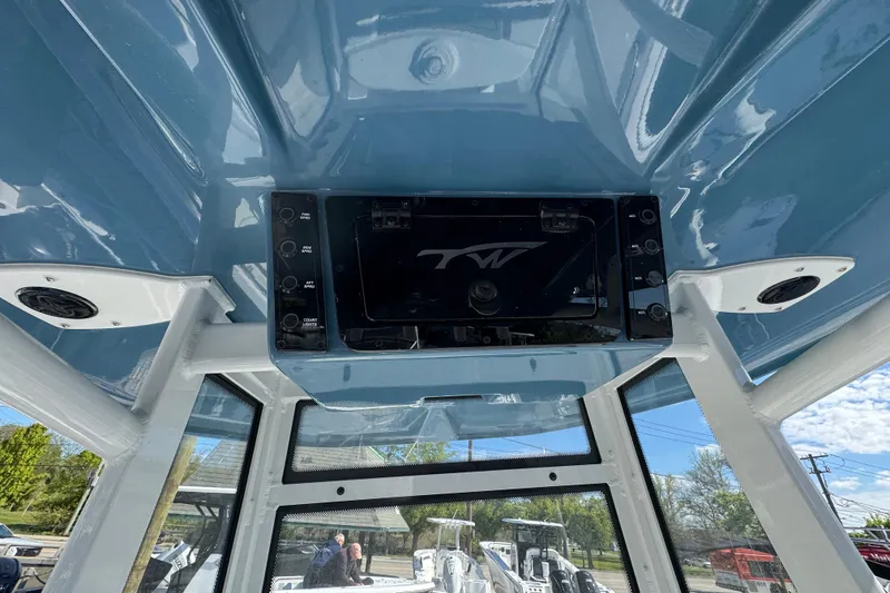 Slide: The Image of Interior view of 2026 Tidewater 220 CC Adventure boat's helm station with electronics. - 13