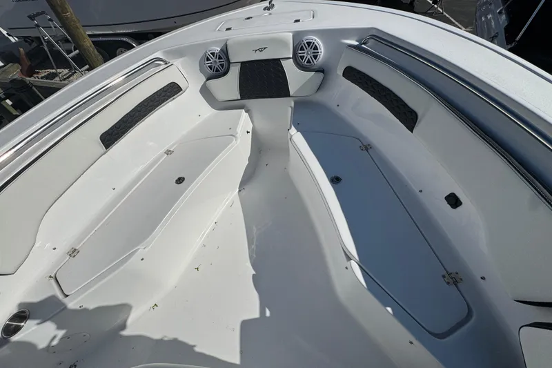 Slide: The Image of 2026 Tidewater 220 CC Adventure boat interior with seating and storage compartments. - 18