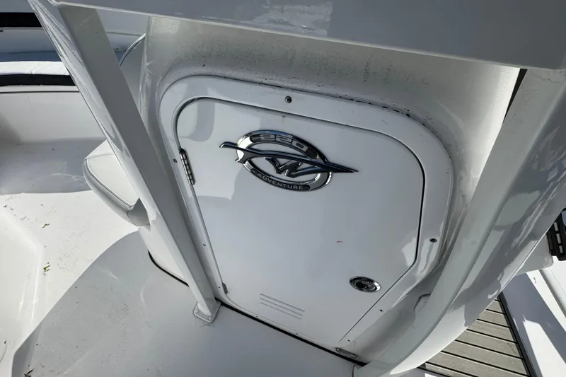Slide: The Image of 2026 Tidewater 220 CC Adventure boat interior with logo on white door. - 29