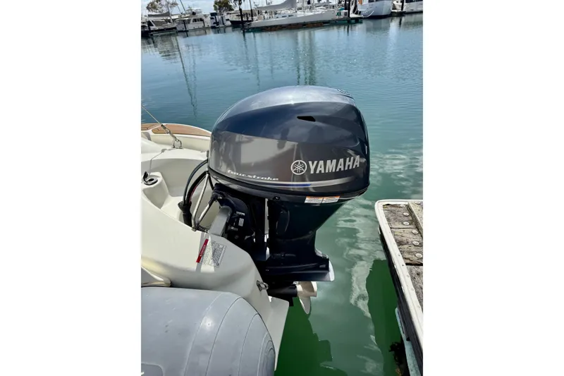Slide: The Image of Yamaha outboard motor on a 1996 Grand Banks 46 Heritage CL boat at a marina. - 10