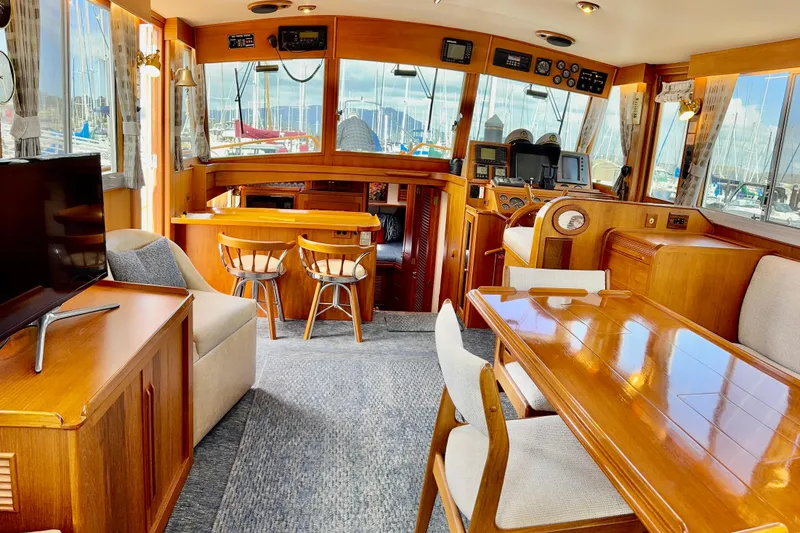 Slide: The Image of Luxurious 1996 Grand Banks 46 Heritage CL yacht interior with elegant wood furnishings and modern amenities. - 15