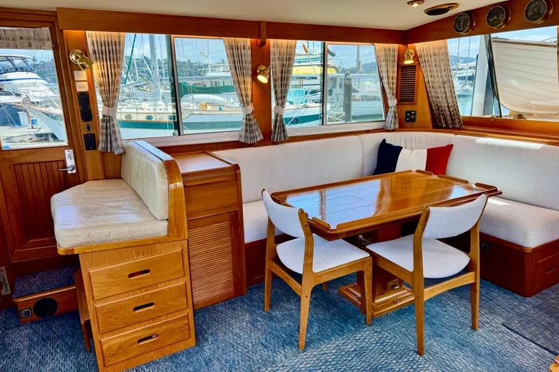 Slide: The Image of Interior of 1996 Grand Banks 46 Heritage CL yacht with elegant wood furnishings and marina view. - 16